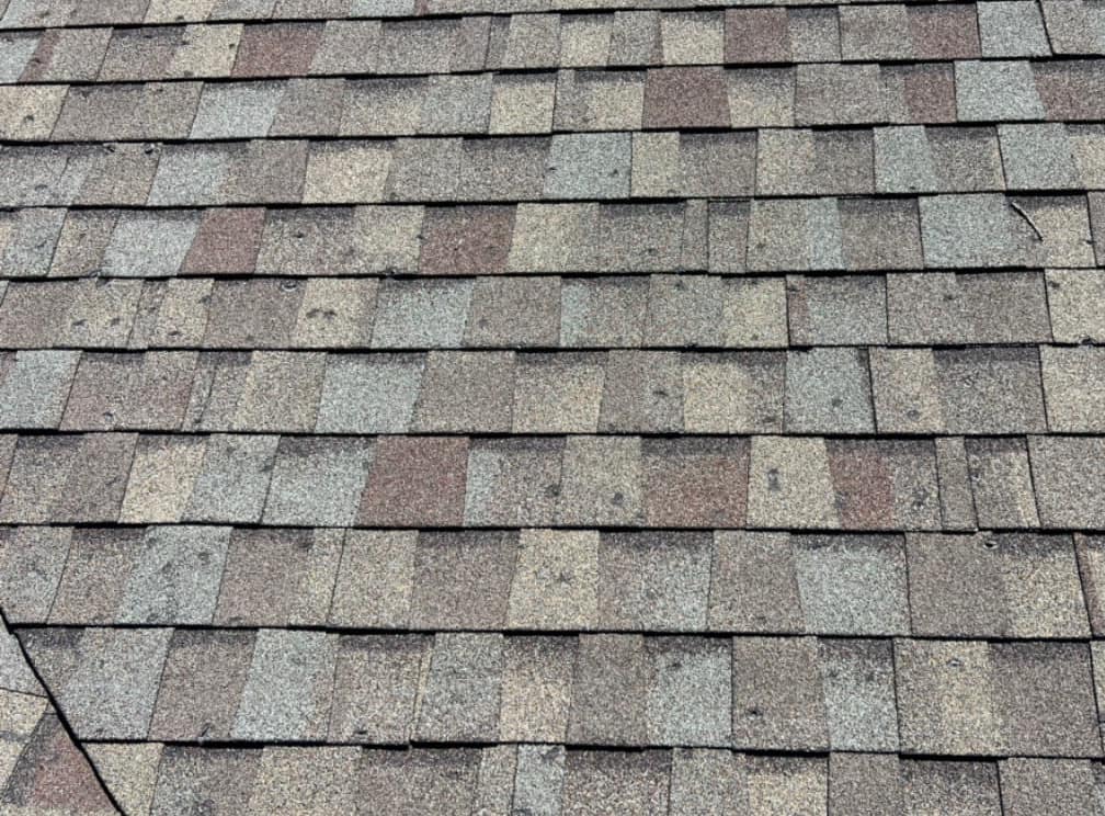 Hail Damage Repair Northeast Ohio | Roof Gutter Now 2 Asphalt shingle roof with extensive hail damage across the surface