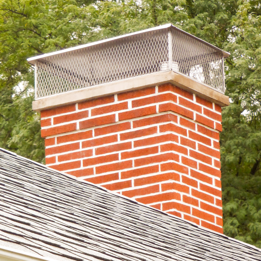 Chimney cap spark arrestor mesh cover installed