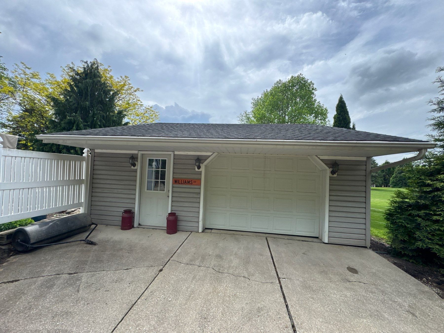 Garage before siding and roof restoration