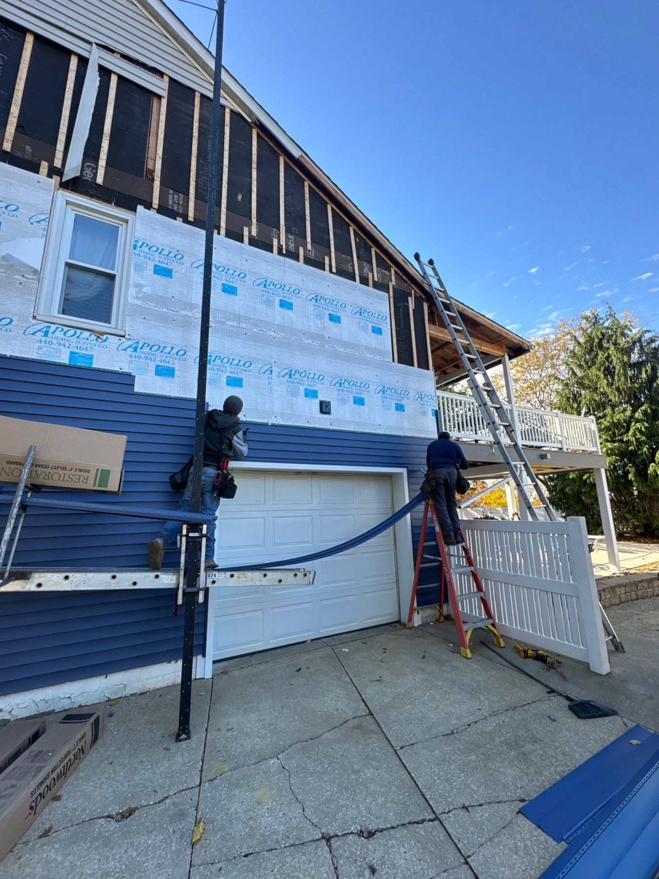 Siding replacement in progress on approved insurance claim