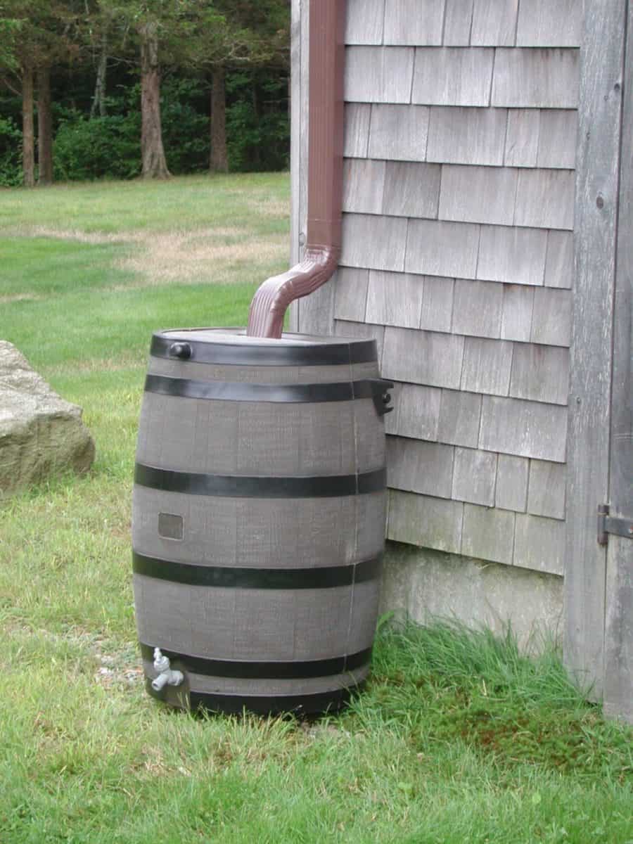 Rain Barrel Installation | Roof Gutter Now 1 Rain barrel connected to gutter downspout