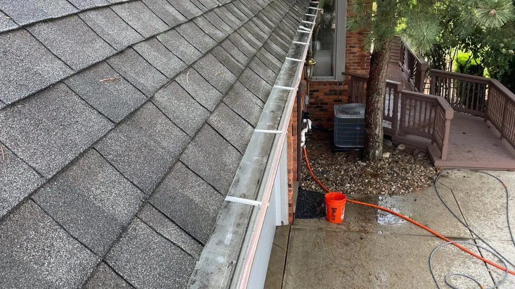 Gutter glistens wet after thorough cleaning with water pressure hose in Westerville, OH