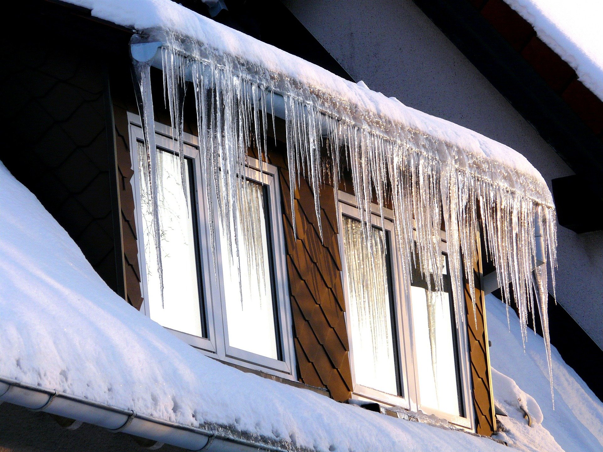Emergency steam ice dam removal at night