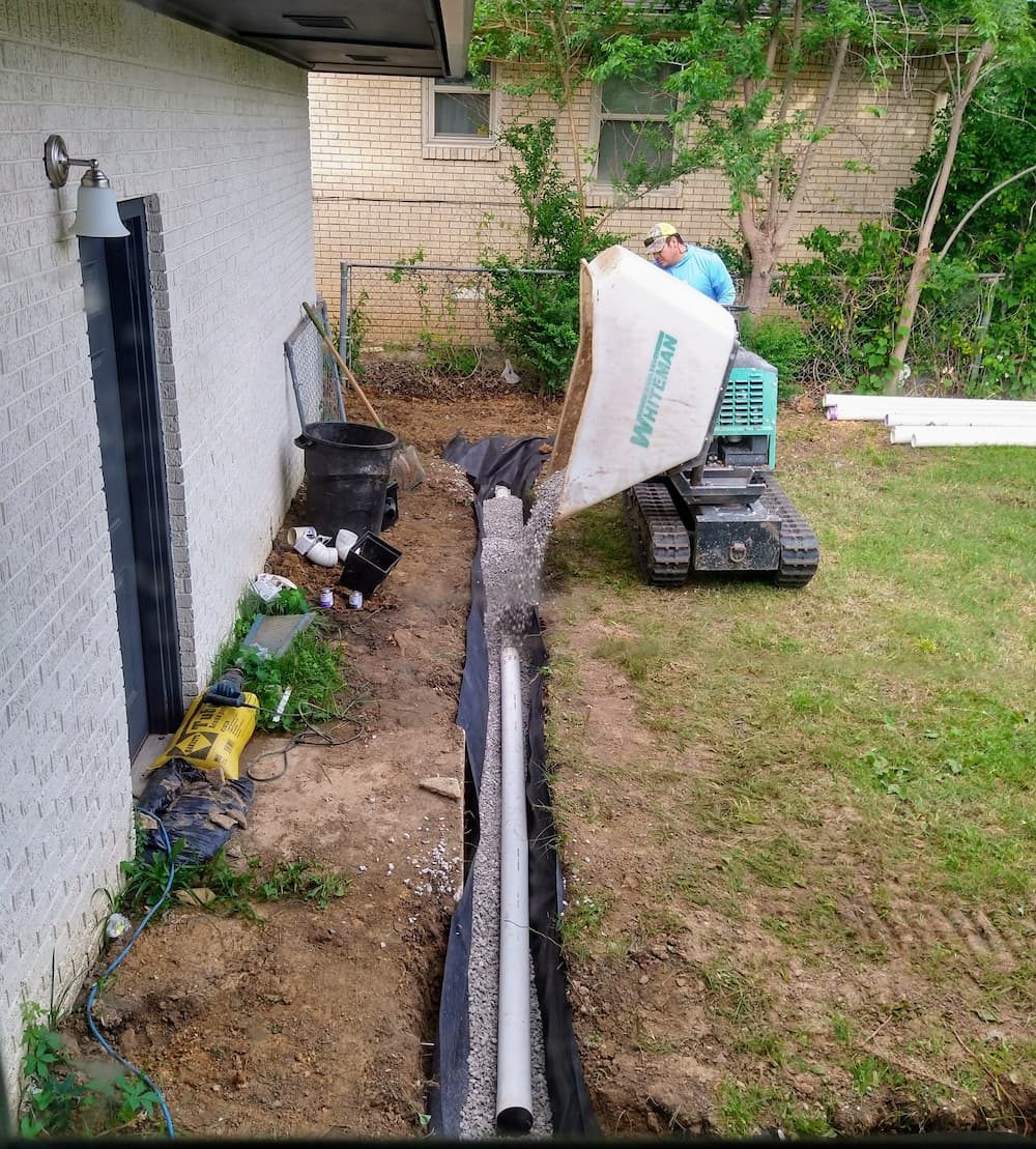 French drain gravel and pipe installed at foundation