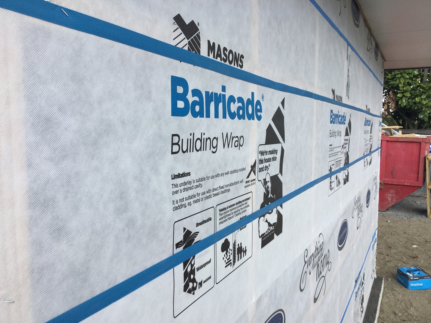 Weather barrier wrap on wall before siding