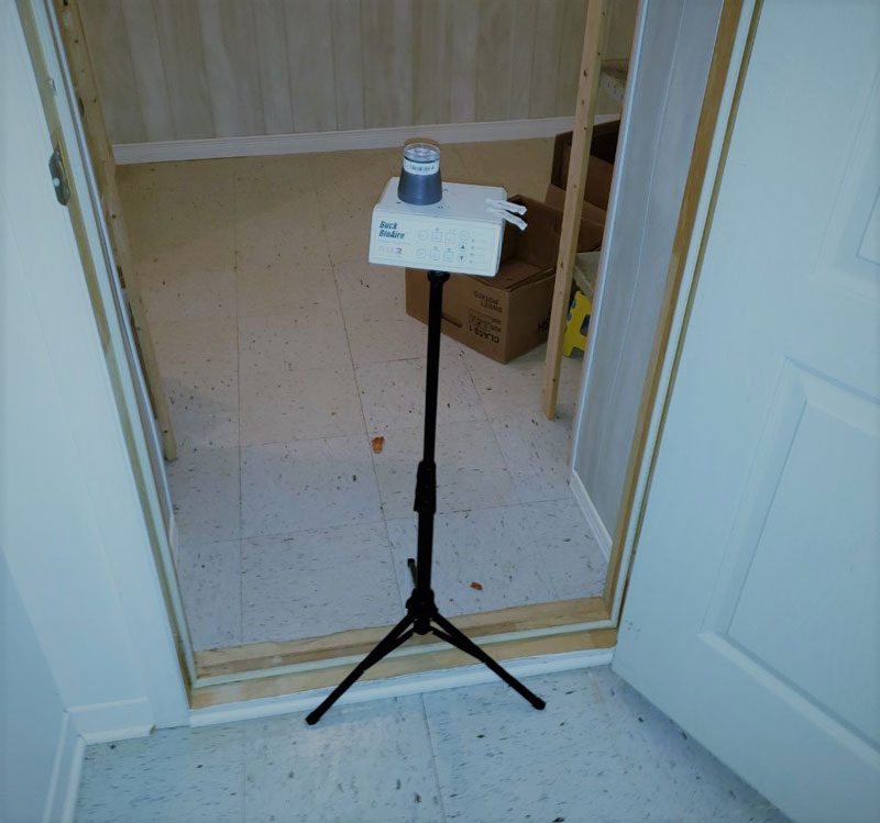 Mold Testing: Air, Surface & PRV | Roof Gutter Now 1 Air sampling equipment on tripod during mold testing