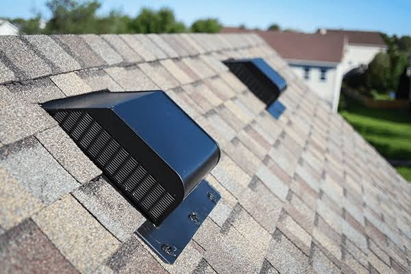 Multiple slant-back roof vents installed on shingle roof