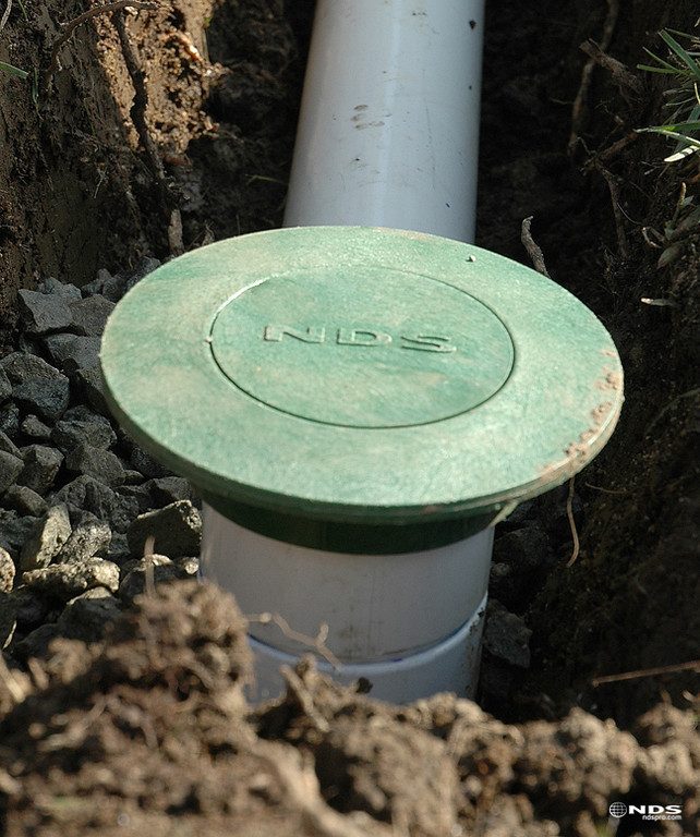 Underground Drain Installation | Roof Gutter Now 2 Pop-up emitter outlet on underground downspout drain