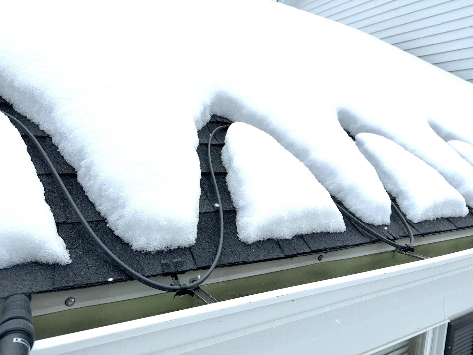 Heated Roof Cables | Roof Gutter Now 1 Heated cable system on snow-covered shingle roof