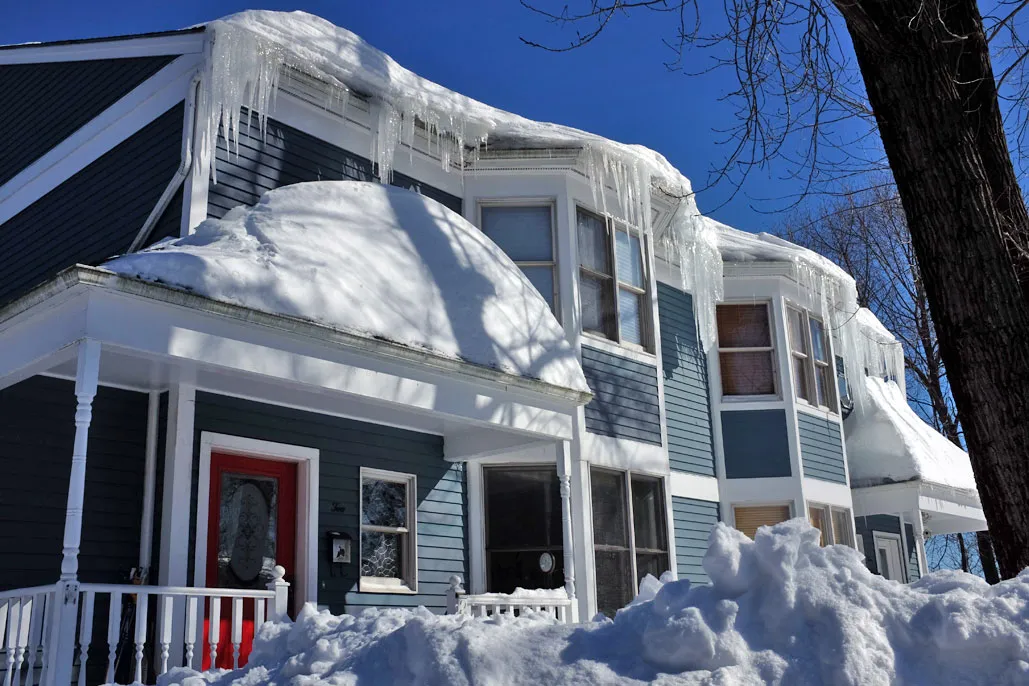 Icicle Removal Services | Roof Gutter Now 1 Roof ice dam with dangerous hanging icicles