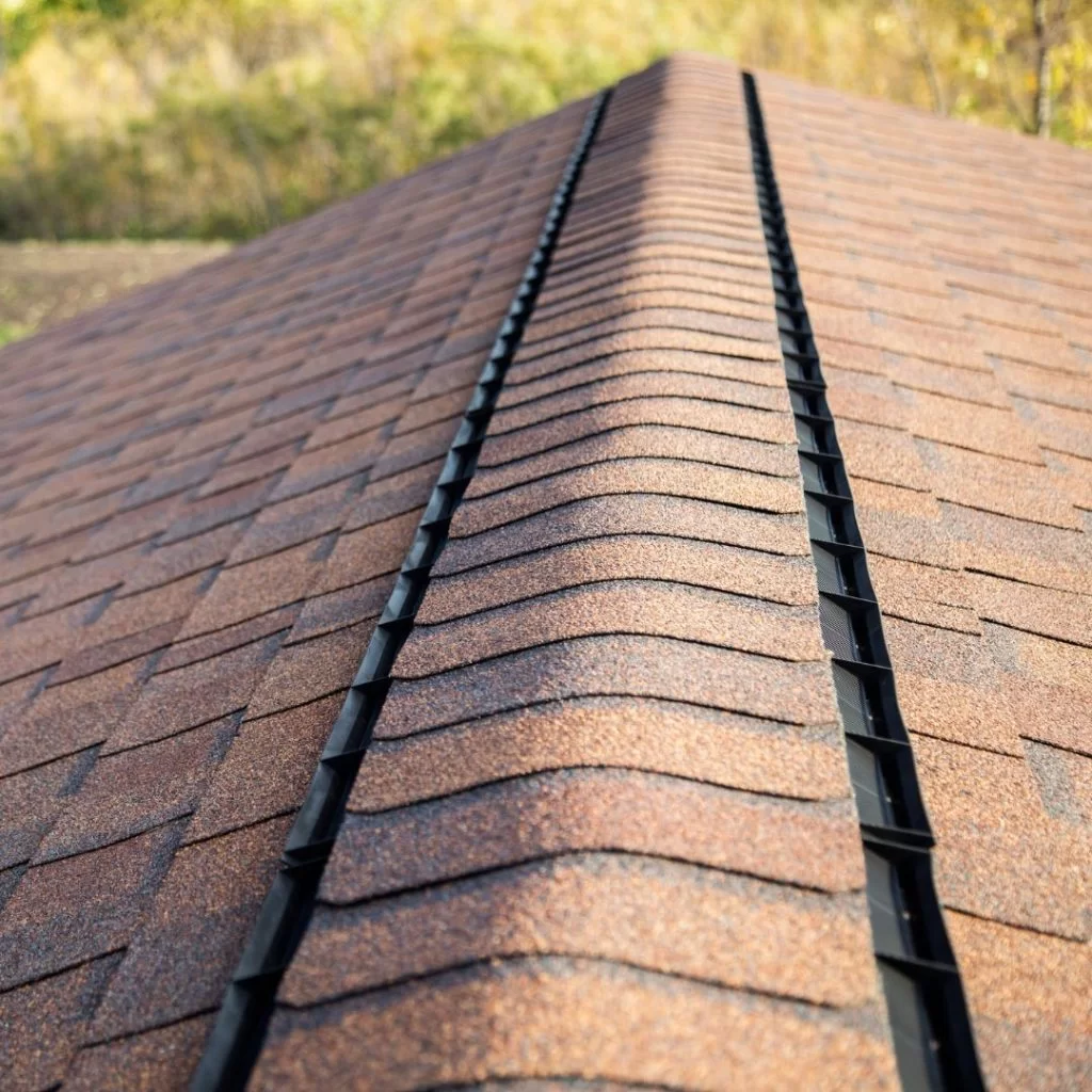 Ridge vent running the peak of an asphalt shingle roof