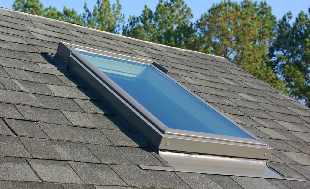 Single skylight installed on asphalt shingle roof