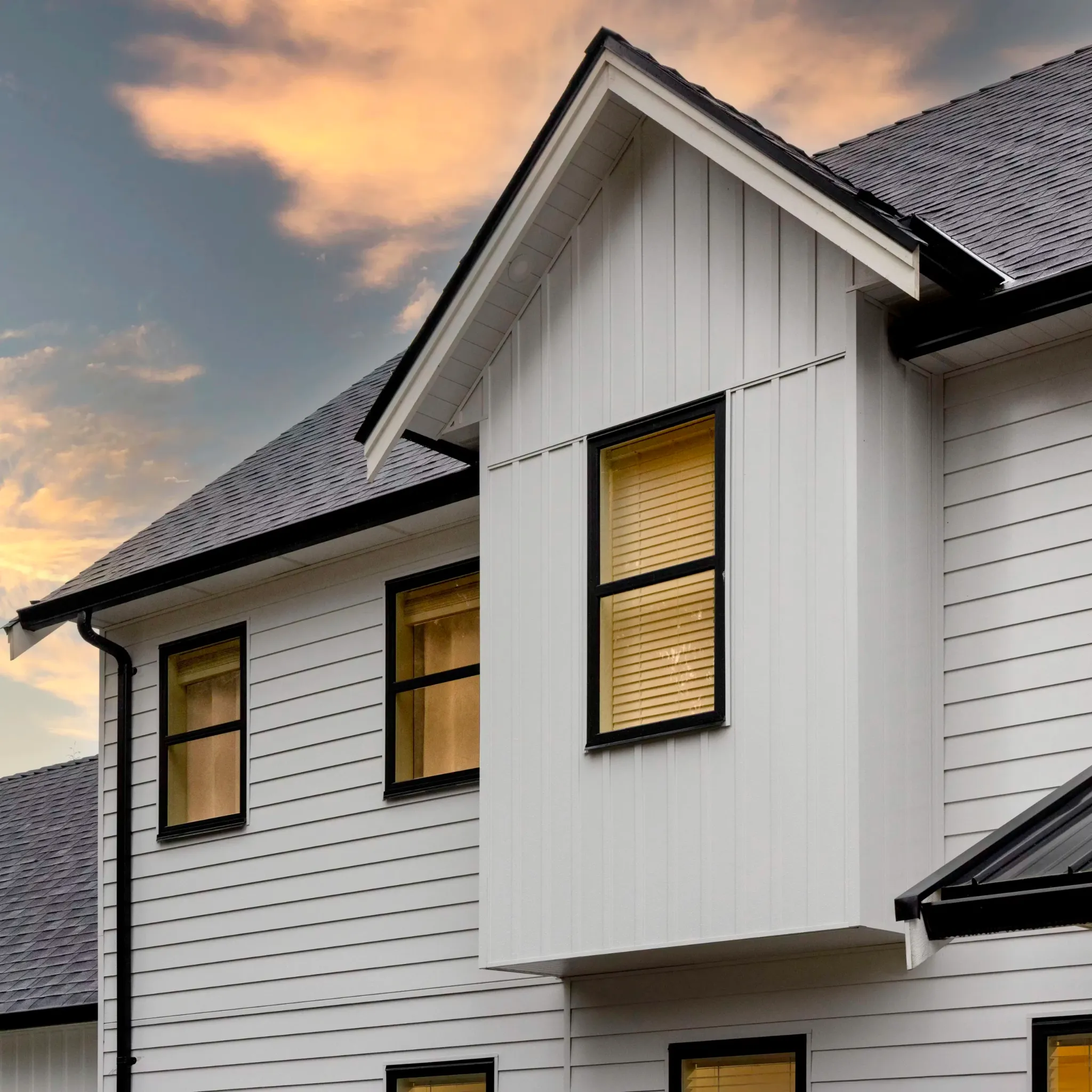 Board & Batten Siding | Roof Gutter Now OH PA NY 2 White board and batten home with black trim